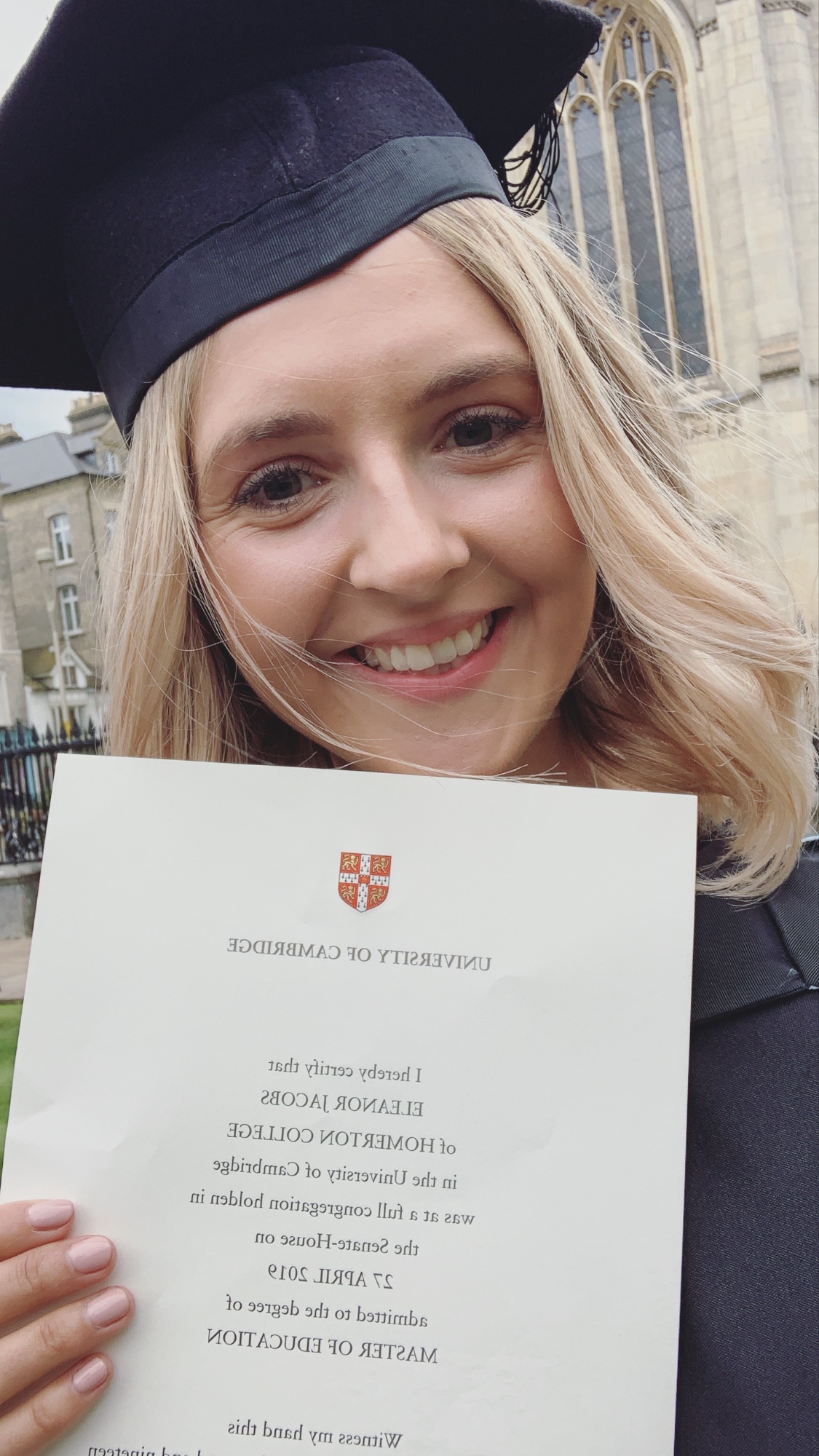 Ellie in her graduation gown from the University of Cambridge